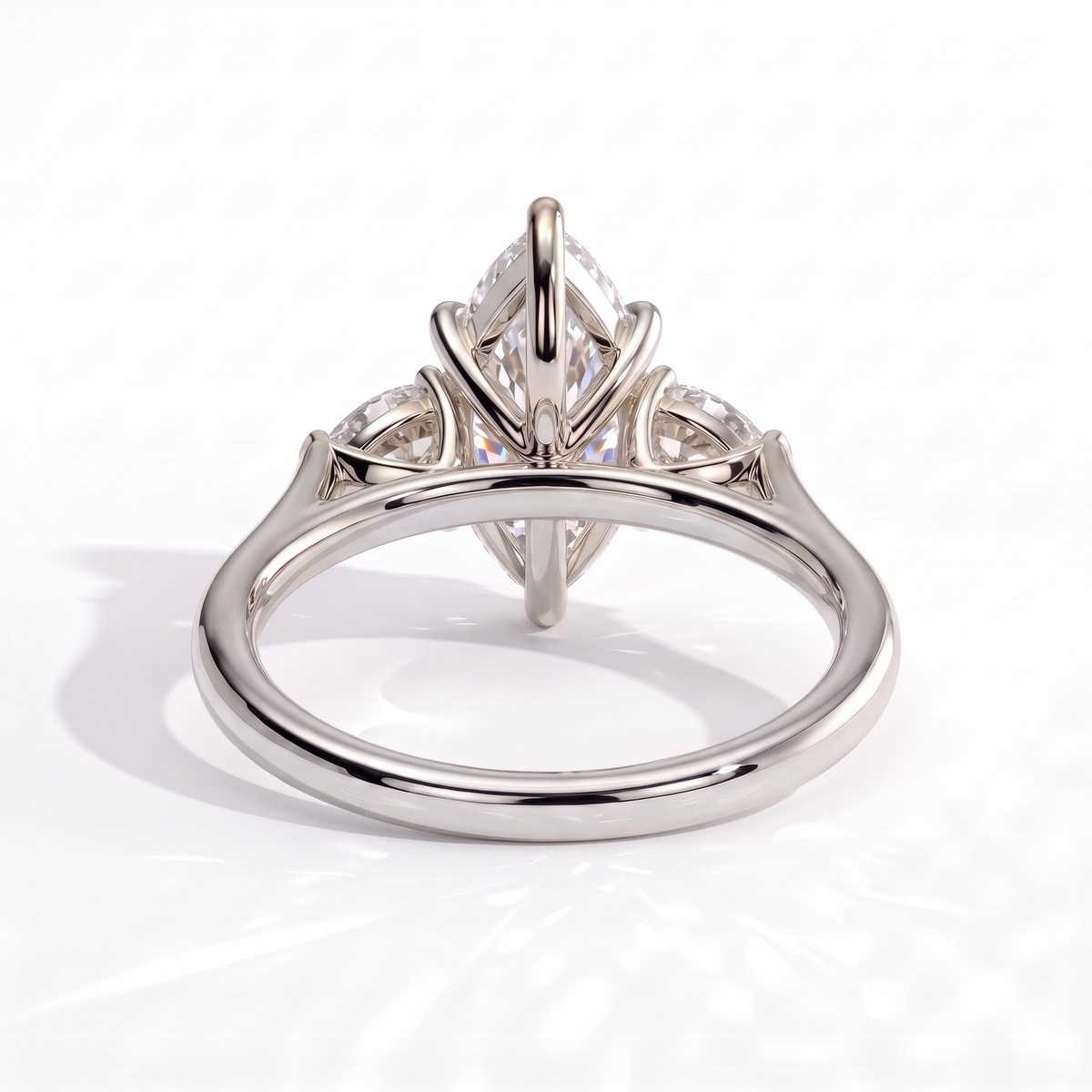 Marquise lab-grown diamond three-stone engagement ring in 18K (750) white gold, on white background 
