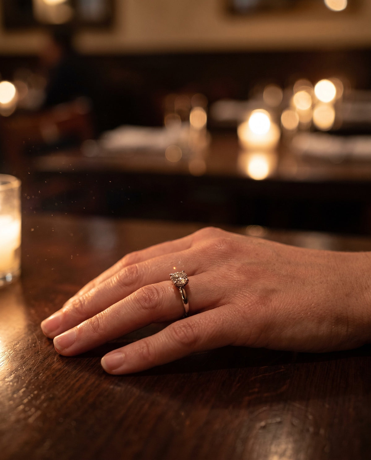 Diamond ring sparkling by candlelight | BEUSÉA