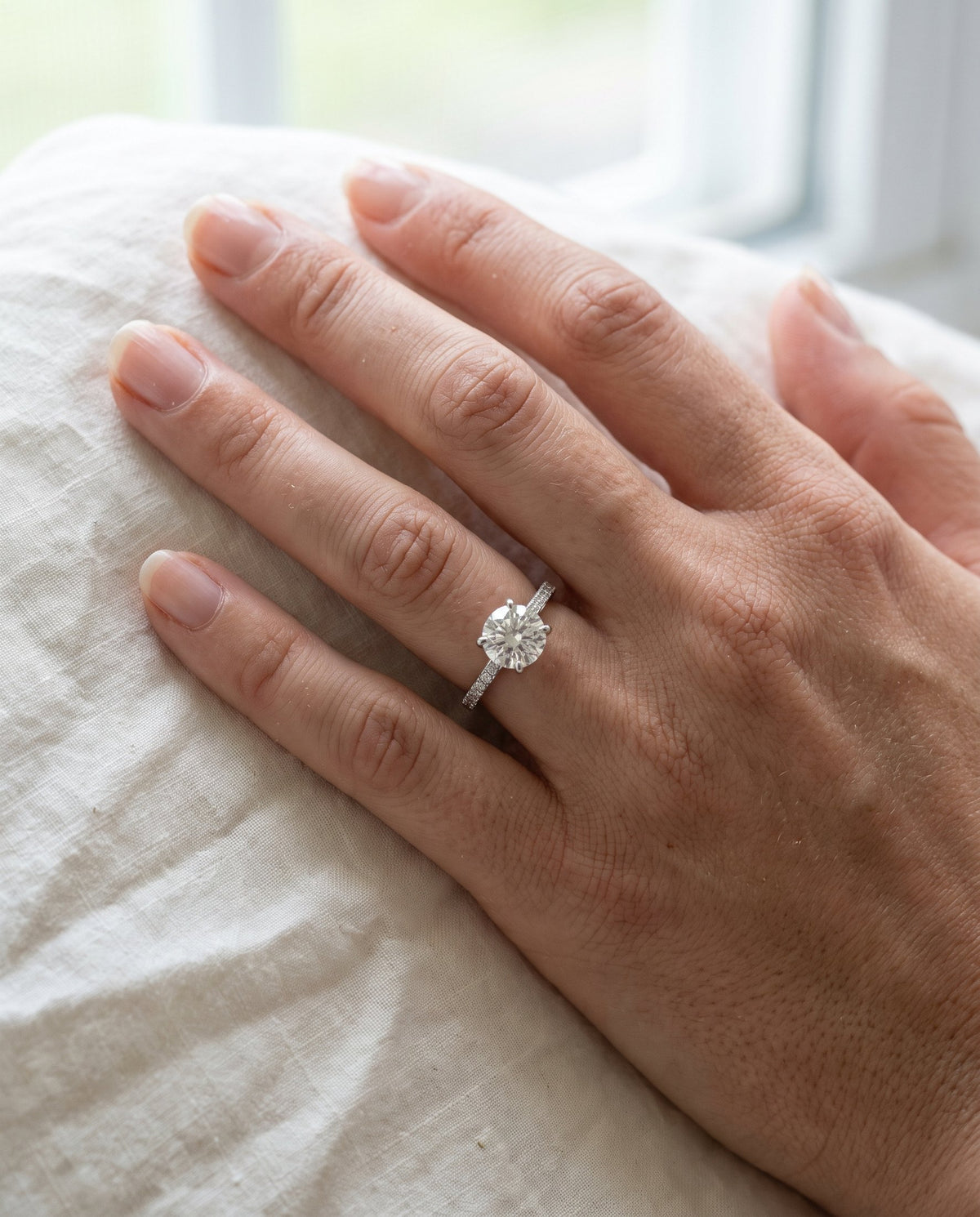 Solitaire engagement ring on a pavé band | BEUSÉA
