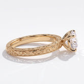 Round lab-grown diamond vintage engraved solitaire engagement ring in 14K (585) yellow gold, close-up of the hand-engraved band 