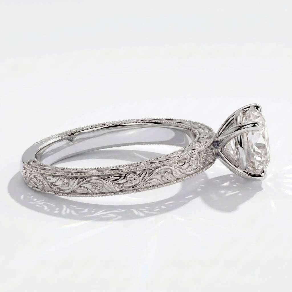 Round lab-grown diamond vintage engraved solitaire engagement ring in 14K (585) white gold, close-up of the hand-engraved band 