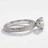 Round lab-grown diamond vintage engraved solitaire engagement ring in 14K (585) white gold, close-up of the hand-engraved band 