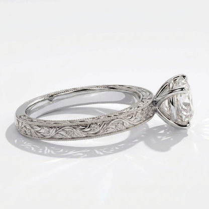 Round lab-grown diamond vintage engraved solitaire engagement ring in 14K (585) white gold, close-up of the hand-engraved band 