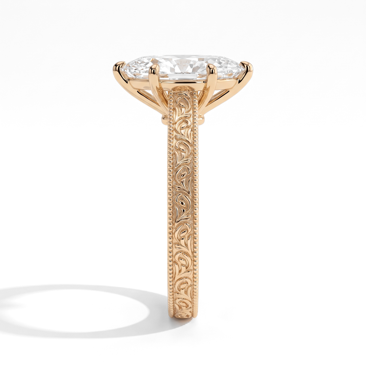 Marquise lab-grown diamond vintage engraved solitaire engagement ring in 14K (585) yellow gold, close-up of the hand-engraved band 