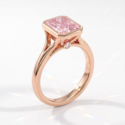 Fancy Vivid Pink radiant lab-grown diamond bezel ring in 14K (585) rose gold, angled view 
