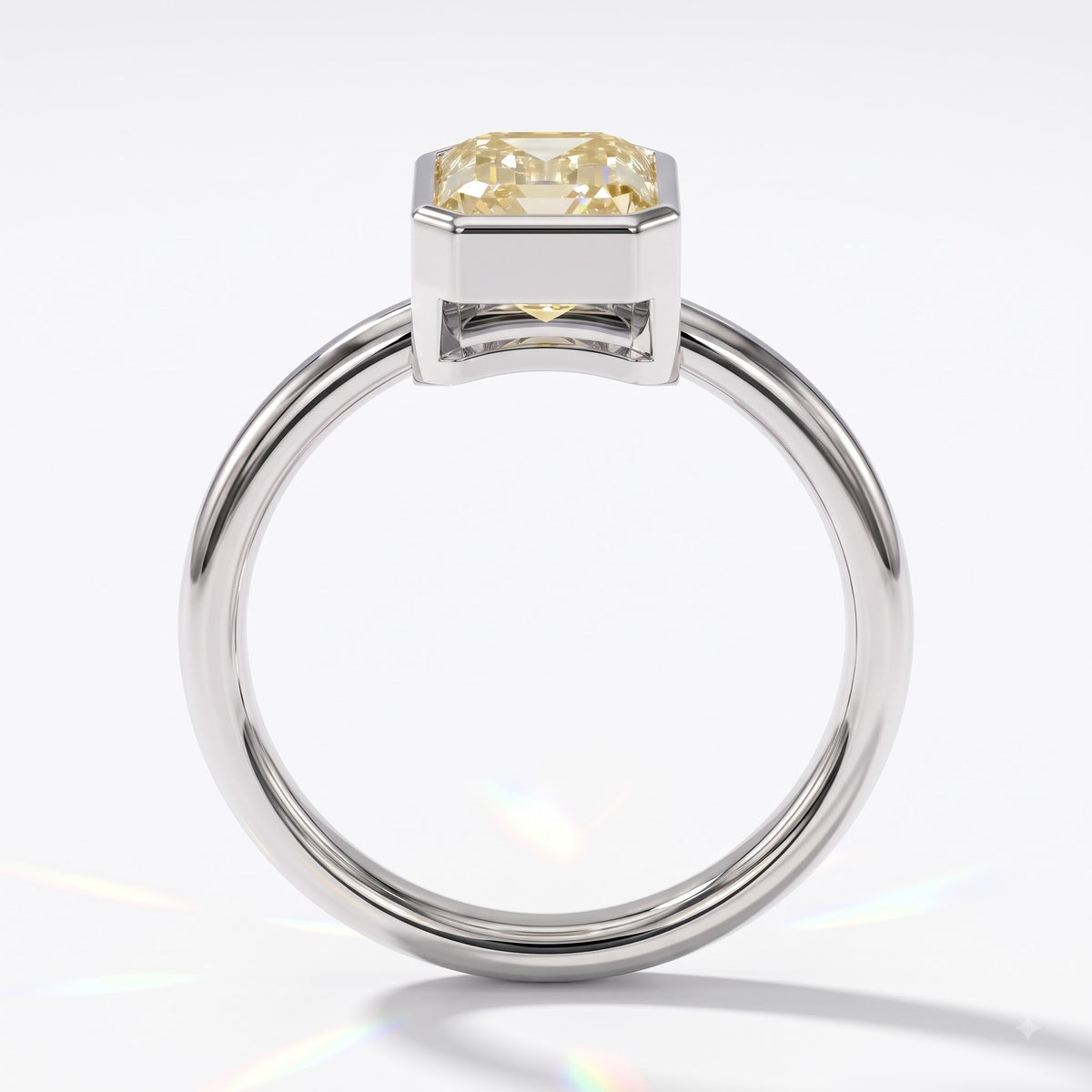 Fancy Intense Yellow emerald cut lab-grown diamond bezel ring in 14K (585) white gold, front view 