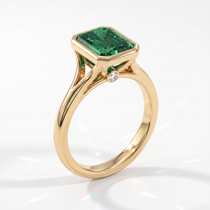 Fancy Vivid Green radiant lab-grown diamond bezel ring in 14K (585) yellow gold, angled view 