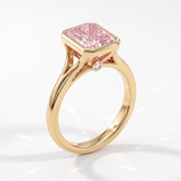 Fancy Vivid Pink radiant lab-grown diamond bezel ring in 14K (585) yellow gold, angled view 