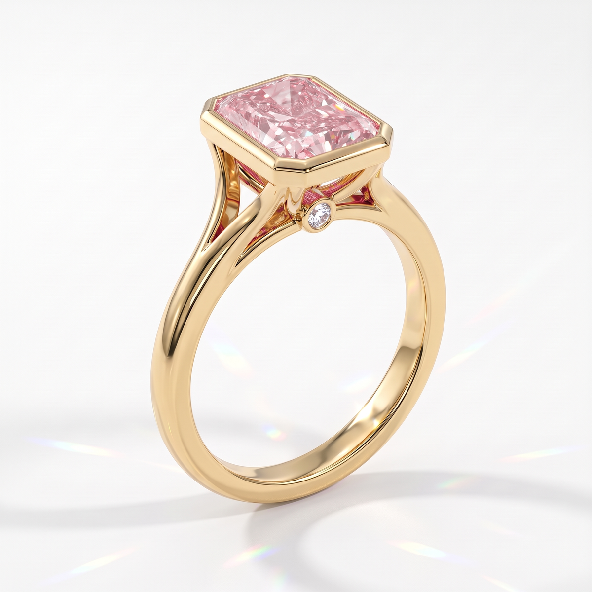 Fancy Vivid Pink radiant lab-grown diamond bezel ring in 14K (585) yellow gold, angled view 