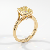 Fancy Vivid Yellow radiant lab-grown diamond bezel ring in 14K (585) yellow gold, angled view 