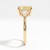 Fancy Vivid Yellow radiant lab-grown diamond three-stone ring with trillion side diamonds in 14K (585) yellow gold, side profile 