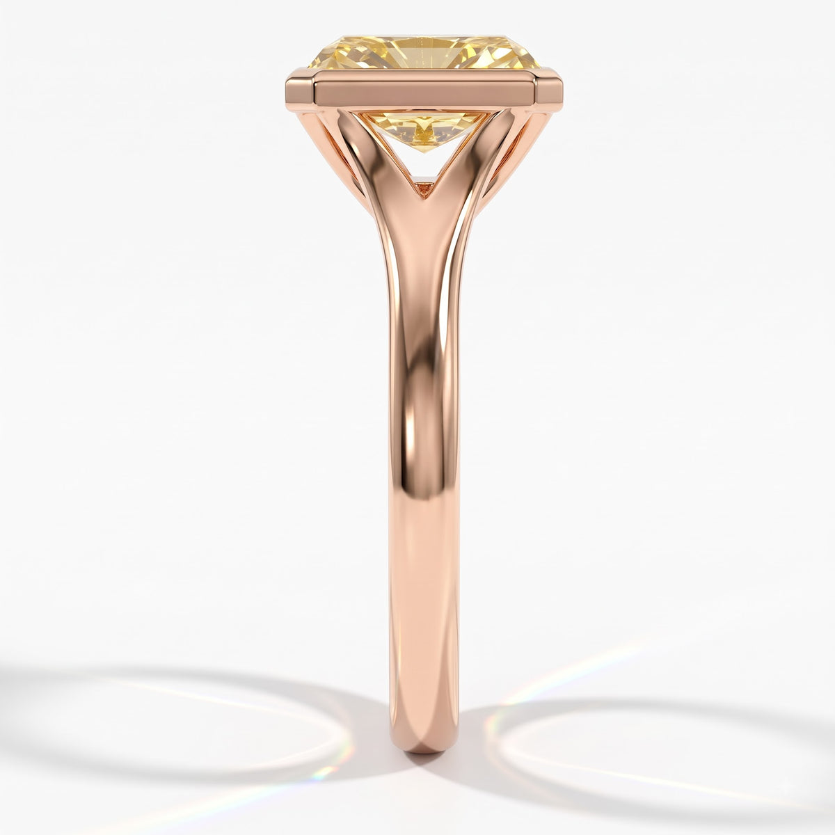 Fancy Vivid Yellow radiant lab-grown diamond bezel ring in 18K (750) rose gold, side profile 