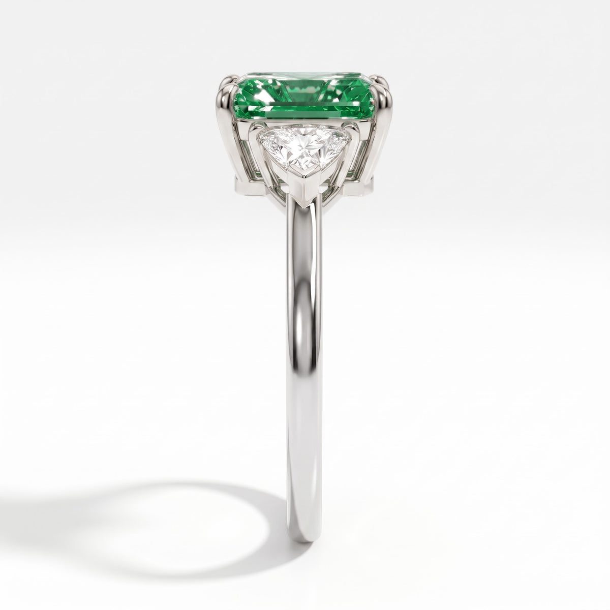 Fancy Vivid Green radiant lab-grown diamond three-stone ring with trillion side diamonds in 18K (750) white gold, side profile 