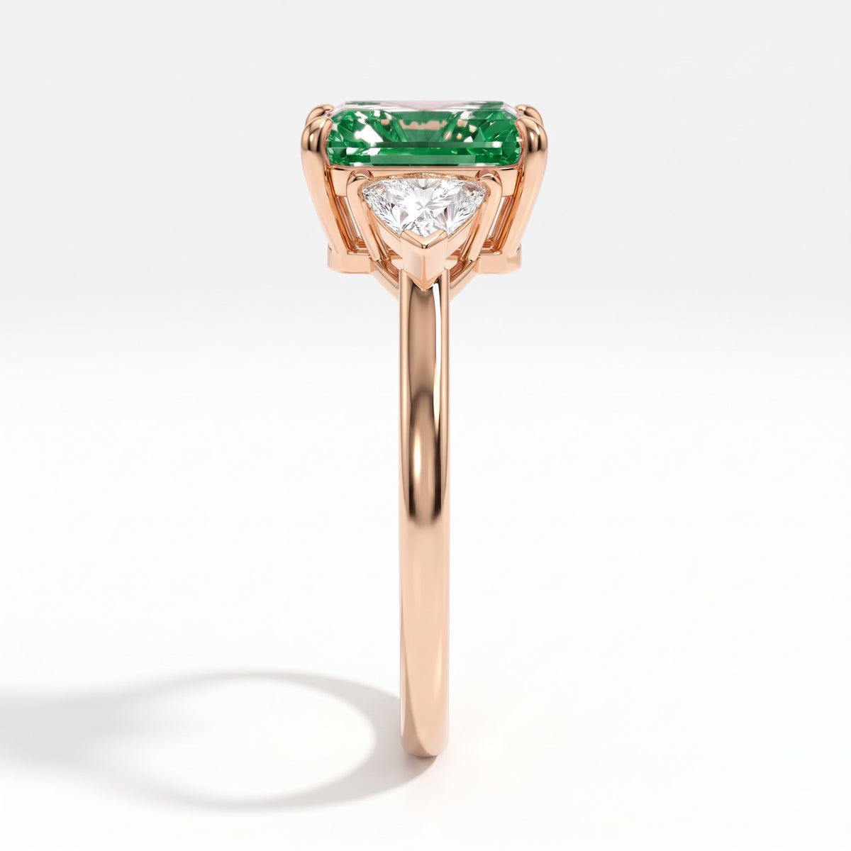 Fancy Vivid Green radiant lab-grown diamond three-stone ring with trillion side diamonds in 14K (585) rose gold, side profile 
