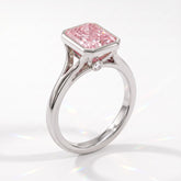 Fancy Vivid Pink radiant lab-grown diamond bezel ring in 14K (585) white gold, angled view 