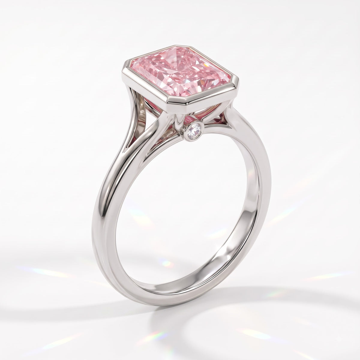 Fancy Vivid Pink radiant lab-grown diamond bezel ring in 18K (750) white gold, angled view 