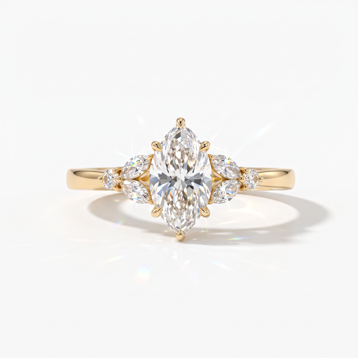 Marquise cut lab-grown diamond leaf cluster engagement ring with marquise and round accents in 18K (750) yellow gold, front view 