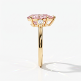 Fancy Vivid Pink pear cut lab-grown diamond three-stone ring with pear side diamonds in 14K (585) yellow gold, side view 