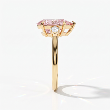 Fancy Vivid Pink pear cut lab-grown diamond three-stone ring with pear side diamonds in 18K (750) yellow gold, side view 