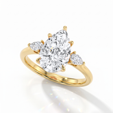 Pear cut lab-grown diamond three-stone engagement ring with pear side stones in 14K (585) yellow gold, angled view 