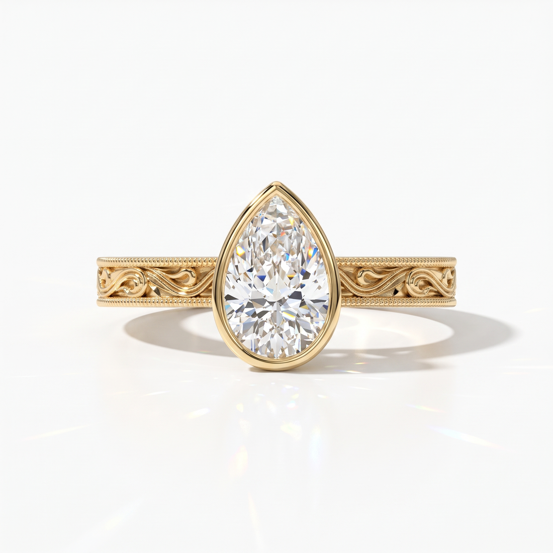 Pear cut lab-grown diamond vintage bezel engagement ring with hand-engraved milgrain band in 14K (585) yellow gold, front view 