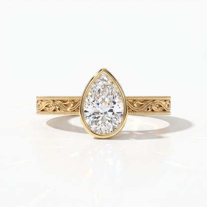 Pear cut lab-grown diamond vintage bezel engagement ring with hand-engraved milgrain band in 14K (585) yellow gold, front view 