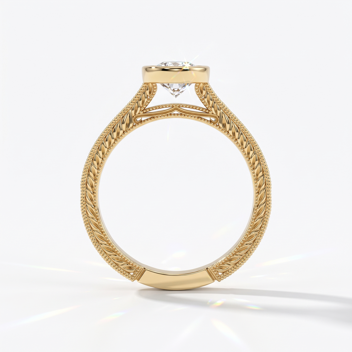 Pear cut lab-grown diamond vintage bezel engagement ring with hand-engraved milgrain band in 14K (585) yellow gold, upright profile view 