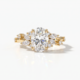 Oval lab-grown diamond cluster engagement ring with marquise and round leaf accents in 14K (585) yellow gold, front view 