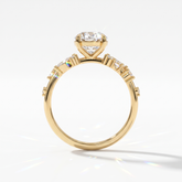 Oval lab-grown diamond cluster engagement ring with marquise and round leaf accents in 18K (750) yellow gold, upright profile view 