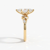 Marquise cut lab-grown diamond vine engagement ring with marquise leaf accents in 18K (750) yellow gold, side view 