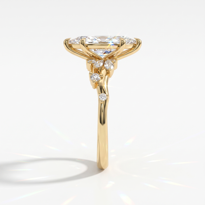 Marquise cut lab-grown diamond cluster engagement ring with marquise and round leaf accents in 14K (585) yellow gold, side view 