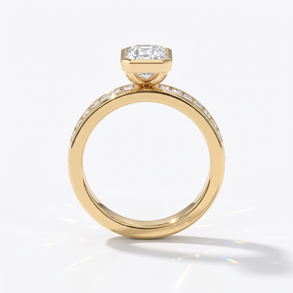 Emerald cut lab-grown diamond bezel engagement ring with channel-set baguette diamonds in 14K (585) yellow gold, upright profile view 