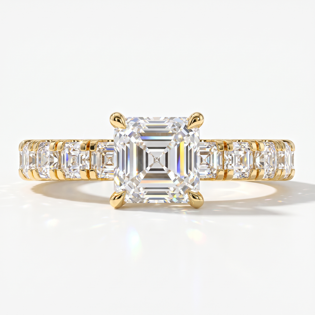 Asscher cut lab-grown diamond engagement ring with Asscher side stones in 14K (585) yellow gold, front view 