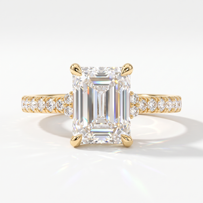 Emerald cut lab-grown diamond hidden halo collar engagement ring with pavé band in 18K (750) yellow gold, front view 