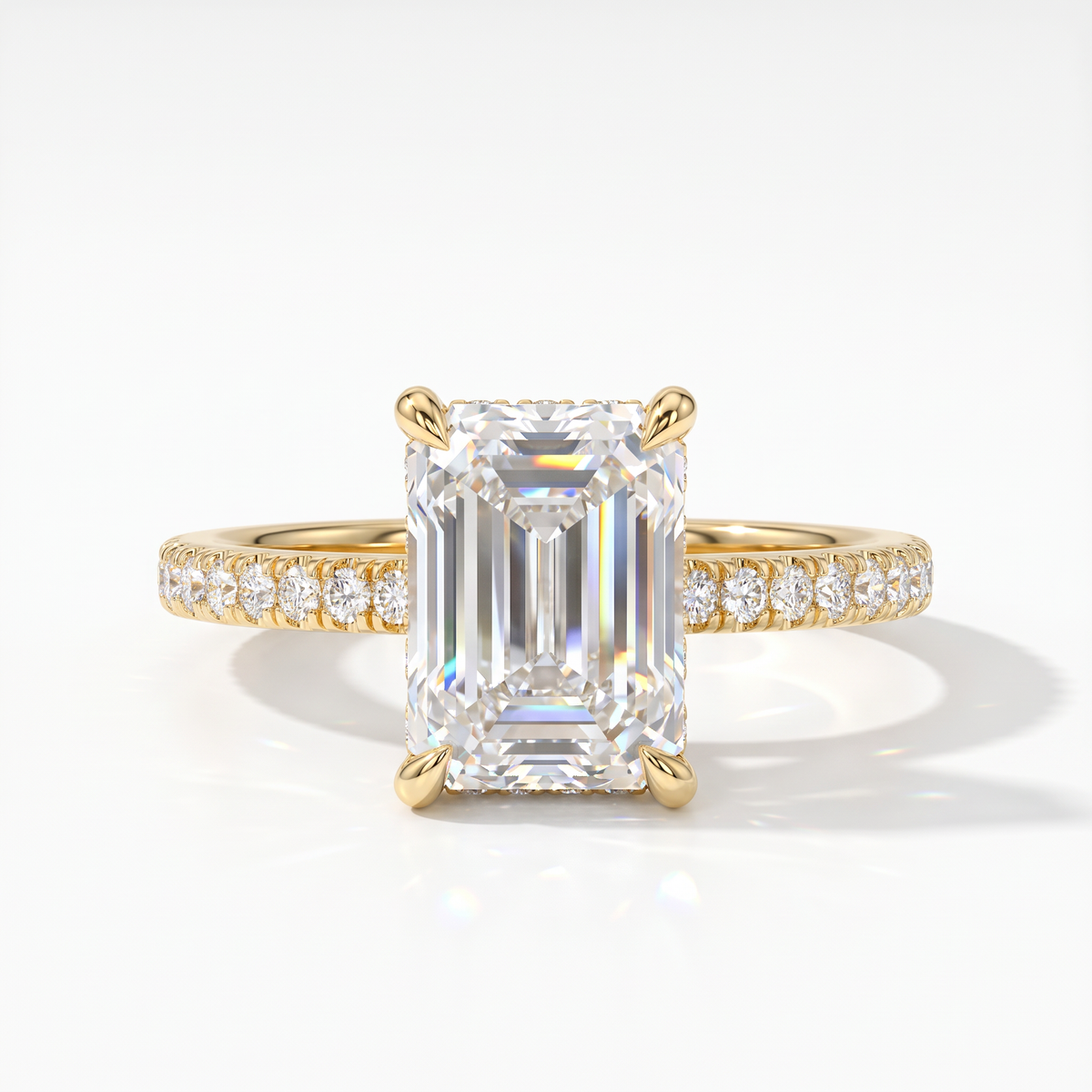 Emerald cut lab-grown diamond hidden halo engagement ring with pavé band in 18K (750) yellow gold, front view 
