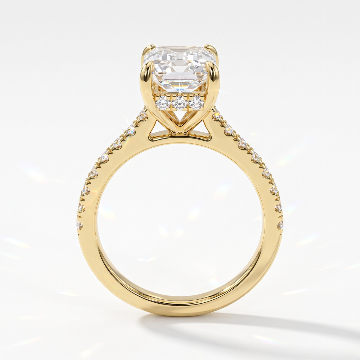 Emerald cut lab-grown diamond hidden halo engagement ring with pavé band in 14K (585) yellow gold, upright profile view 