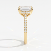 Emerald cut lab-grown diamond hidden halo engagement ring with pavé band in 14K (585) yellow gold, side view 