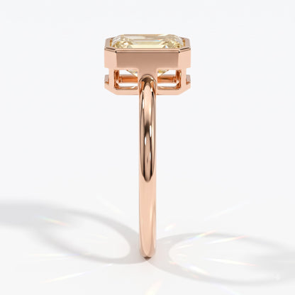 Fancy Intense Yellow emerald cut lab-grown diamond bezel ring in 14K (585) rose gold, side profile 