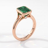 Fancy Vivid Green radiant lab-grown diamond bezel ring in 14K (585) rose gold, angled view 