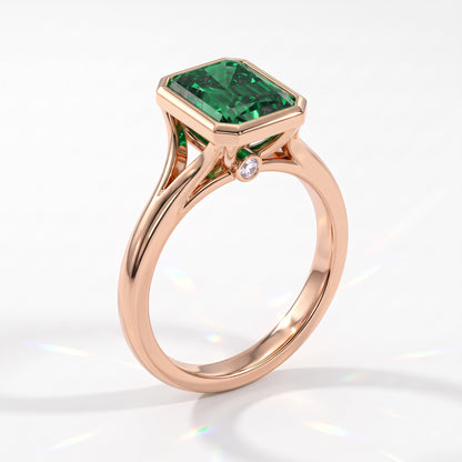 Fancy Vivid Green radiant lab-grown diamond bezel ring in 18K (750) rose gold, angled view 