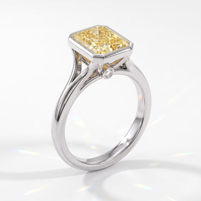 Fancy Vivid Yellow radiant lab-grown diamond bezel ring in 14K (585) white gold, angled view 