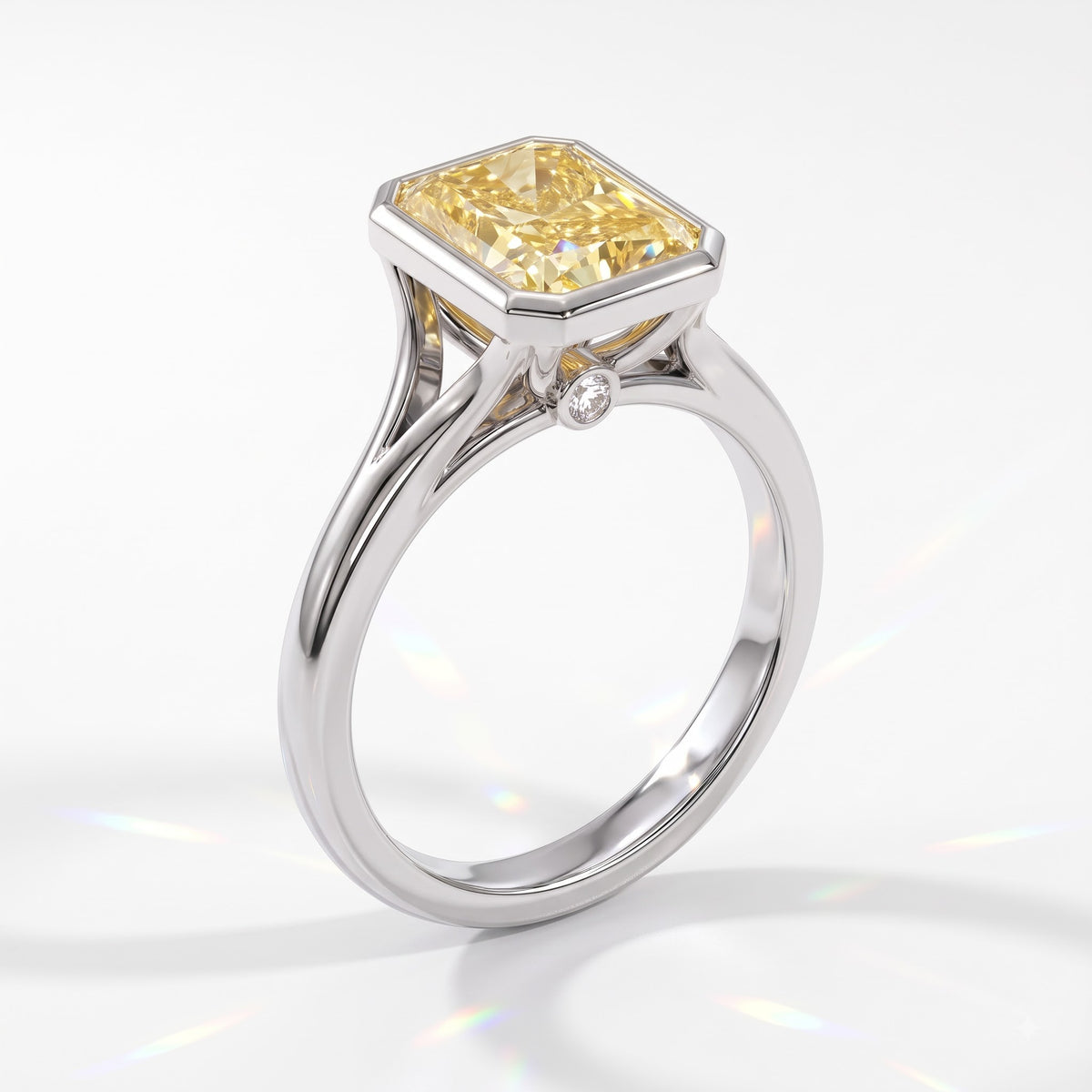 Fancy Vivid Yellow radiant lab-grown diamond bezel ring in 18K (750) white gold, angled view 