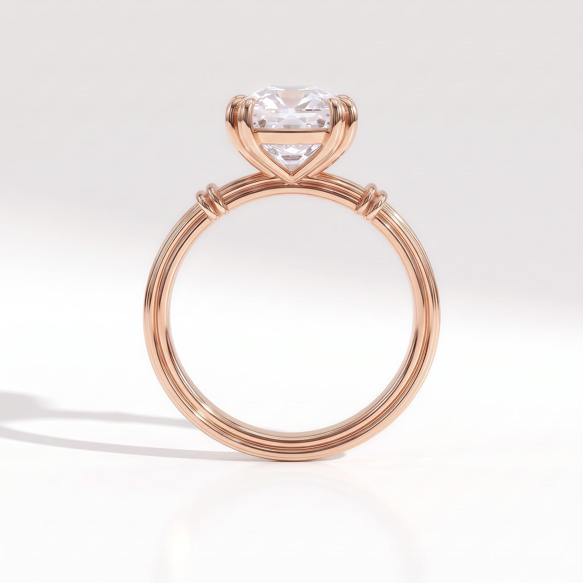 Old mine cushion lab-grown diamond vintage solitaire engagement ring with fluted band in 14K (585) rose gold, profile view showing the double-claw basket 