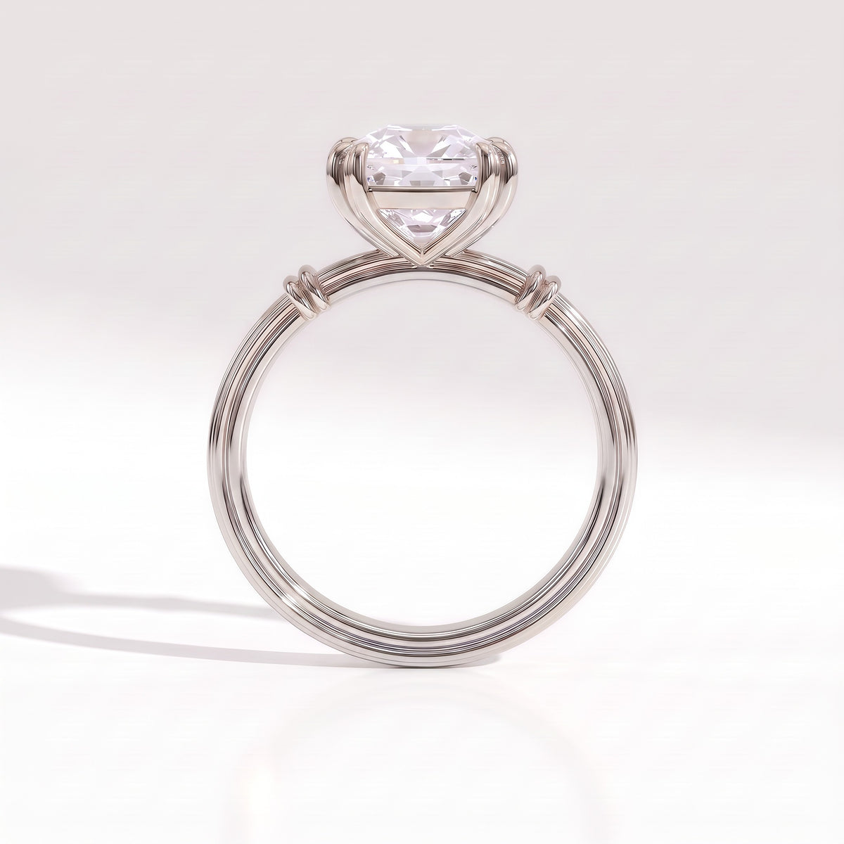 Old mine cushion lab-grown diamond vintage solitaire engagement ring with fluted band in 14K (585) white gold, profile view showing the double-claw basket 