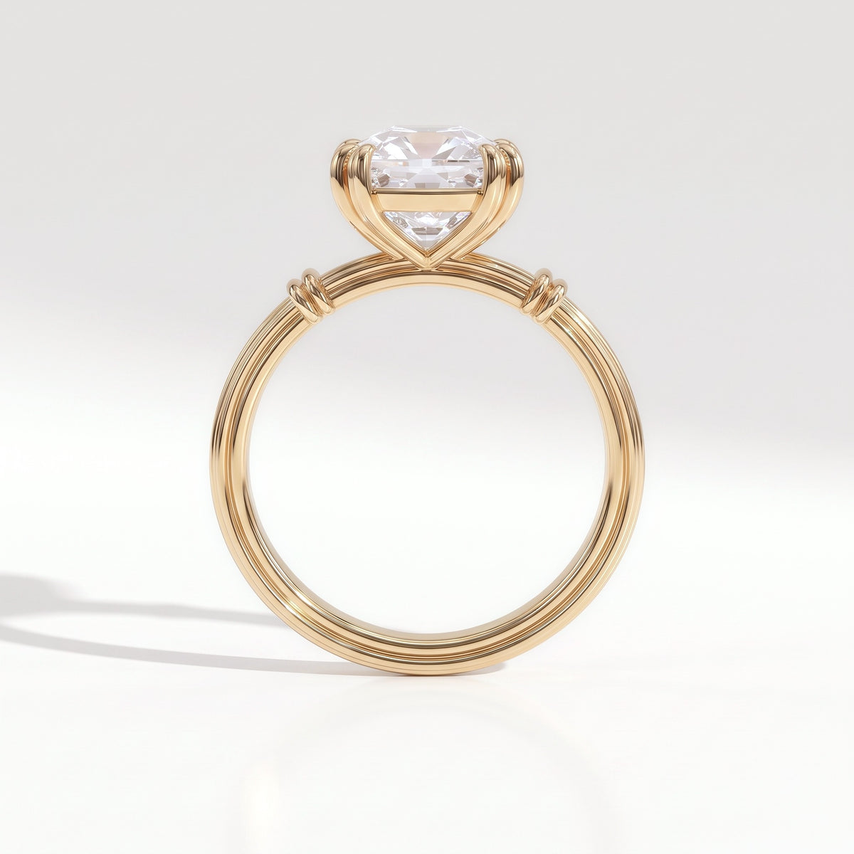 Old mine cushion lab-grown diamond vintage solitaire engagement ring with fluted band in 14K (585) yellow gold, profile view showing the double-claw basket 