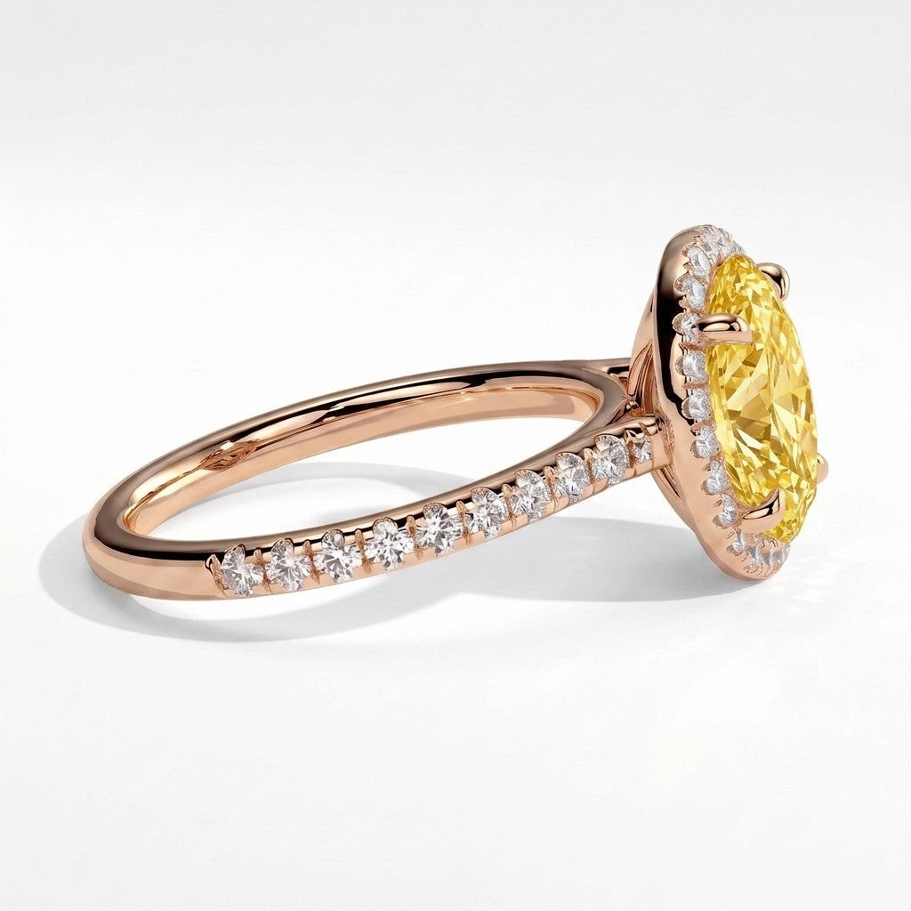Fancy Vivid Yellow oval lab-grown diamond halo engagement ring with cathedral pavé band in 18K (750) rose gold, detail view of the halo and pavé band 