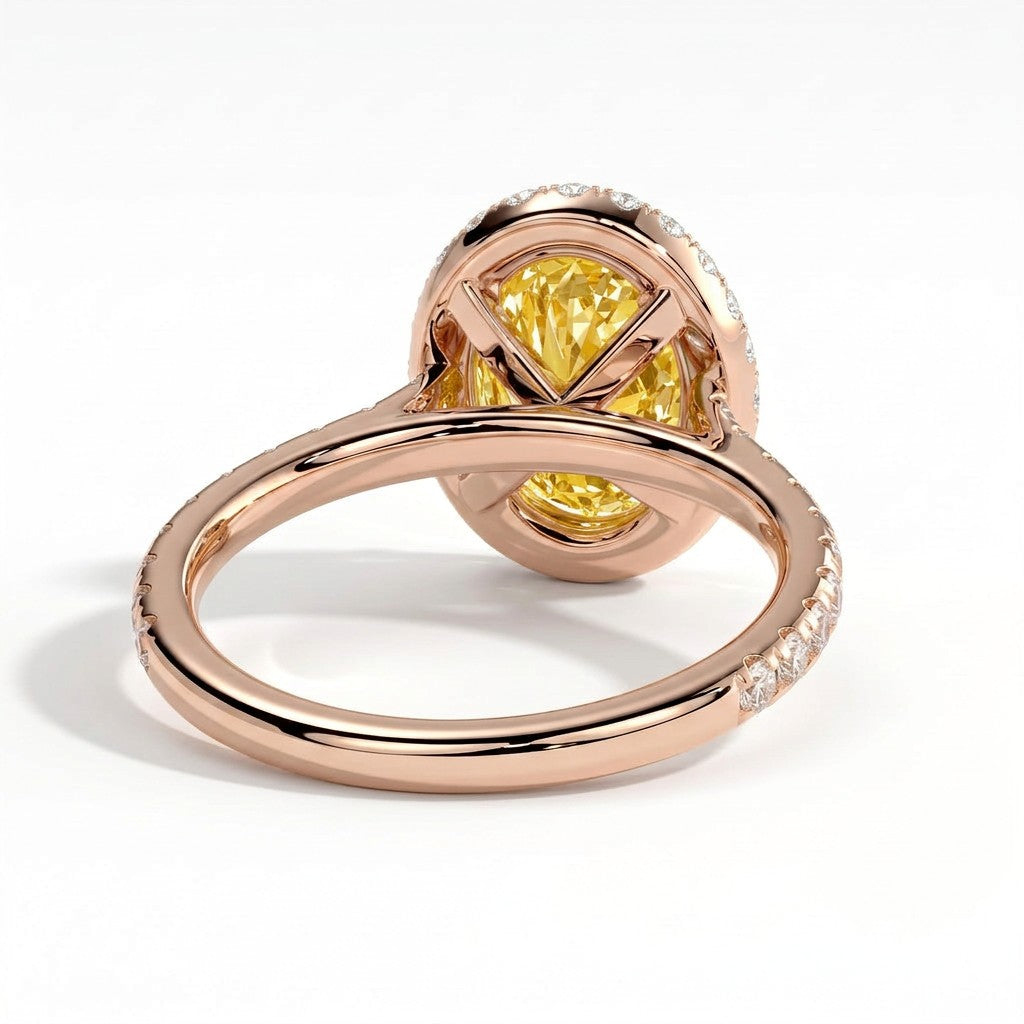 Fancy Vivid Yellow oval lab-grown diamond halo engagement ring with cathedral pavé band in 18K (750) rose gold, on white background 