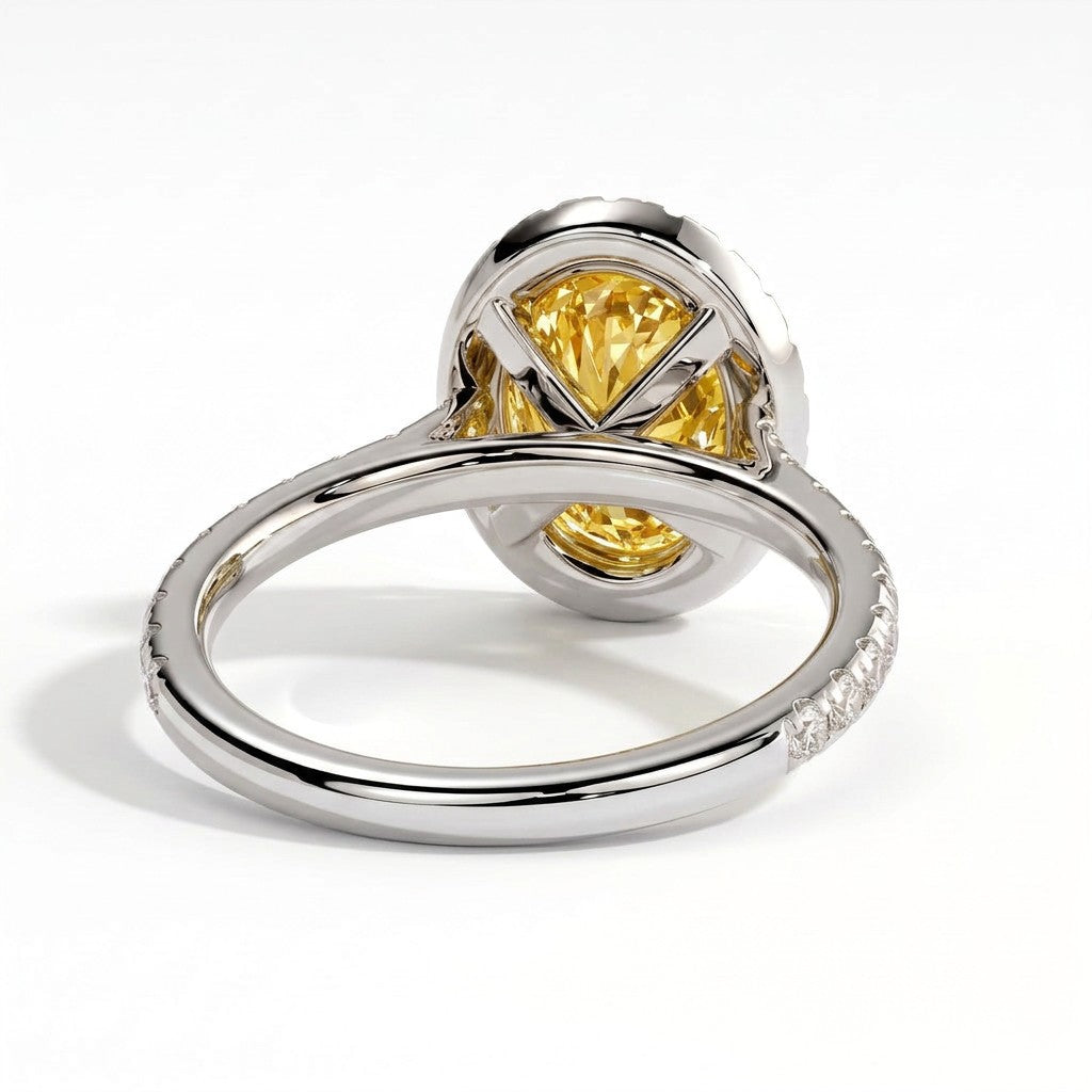 Fancy Vivid Yellow oval lab-grown diamond halo engagement ring with cathedral pavé band in 18K (750) white gold, on white background 