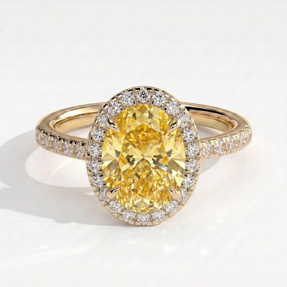Fancy Vivid Yellow oval lab-grown diamond halo engagement ring with cathedral pavé band in 18K (750) yellow gold, front view 