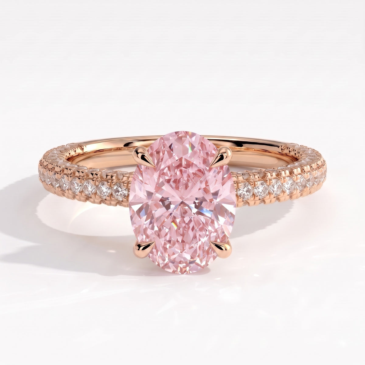 Fancy Vivid Pink oval lab-grown diamond engagement ring with triple pavé band and hidden halo in 18K (750) rose gold, front view 